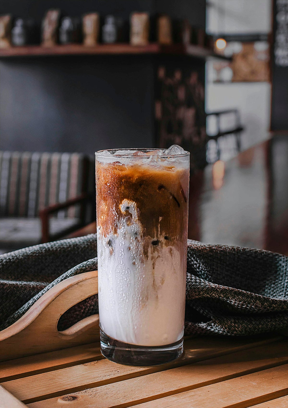 Ube coffee with espresso poured over lilac ube milk and ice