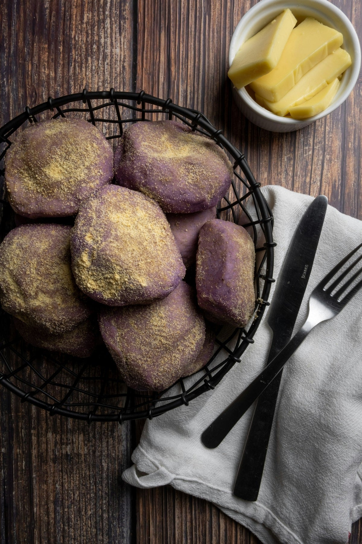 Freshly baked ube pandesal rolls